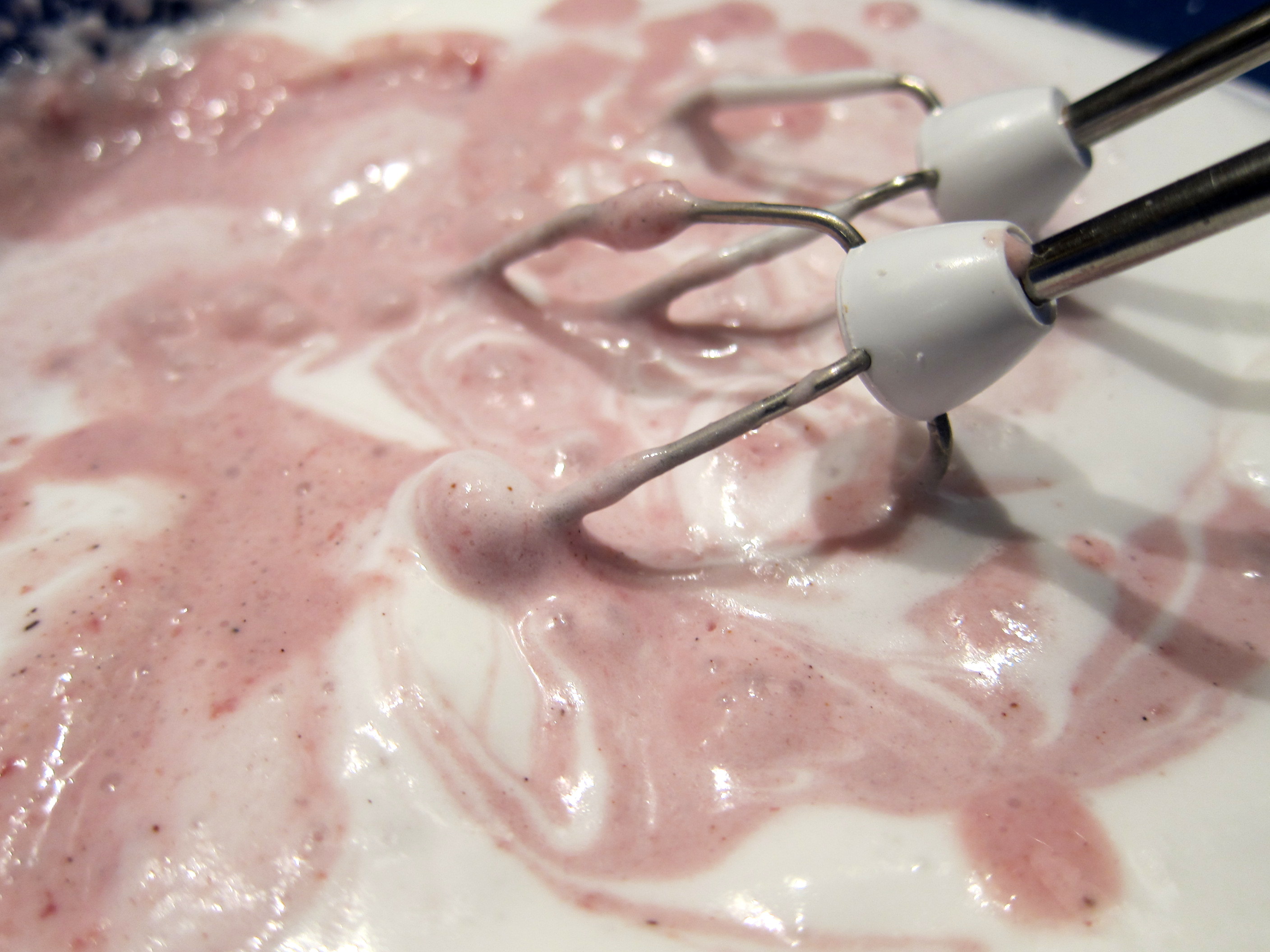 Mixing it all together! The base comes together in three steps - first, the egg whites and the sugar. Secondly, the whipped cream is added. Lastly, the puréed cherries are added and all is whisked together.