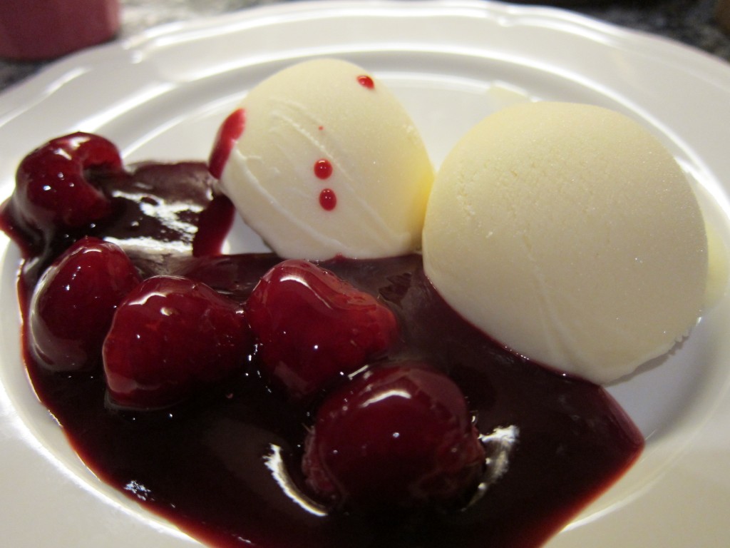 Spicy orange gelato with delicious raspberry red wine sauce