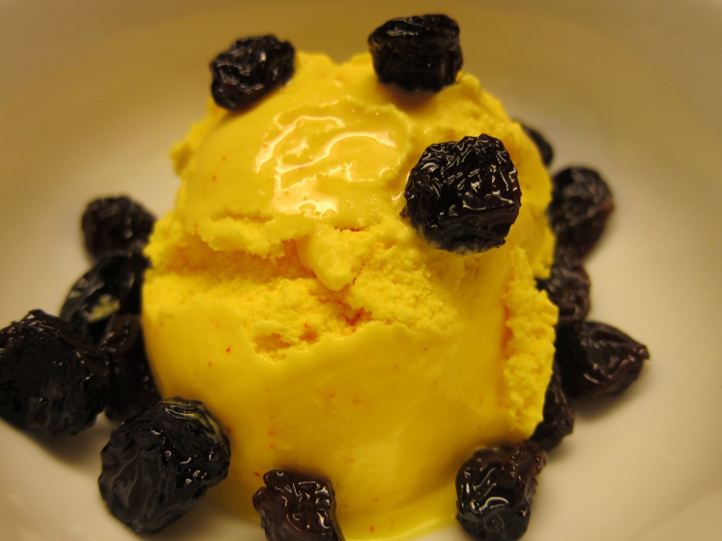 Saffron frozen yoghurt, with soaked raisins as add-ons