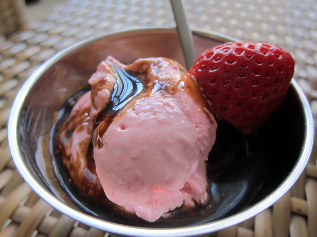 Delicious strawberry marscarpone ice cream drizzled with sumptuous balsamic vinegar